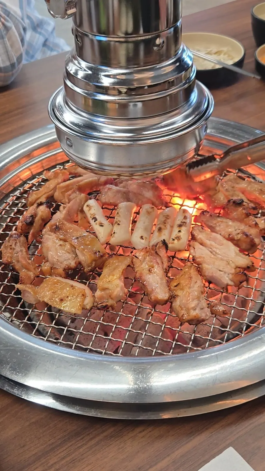 Charcoal-grilled soy sauce dakgalbi cooking over real charcoal