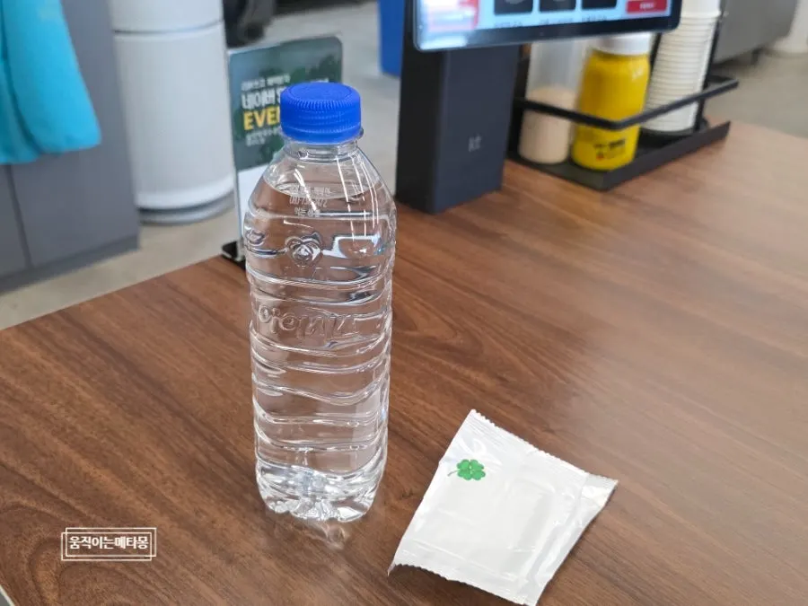 Table setting with bottled water and wet wipes