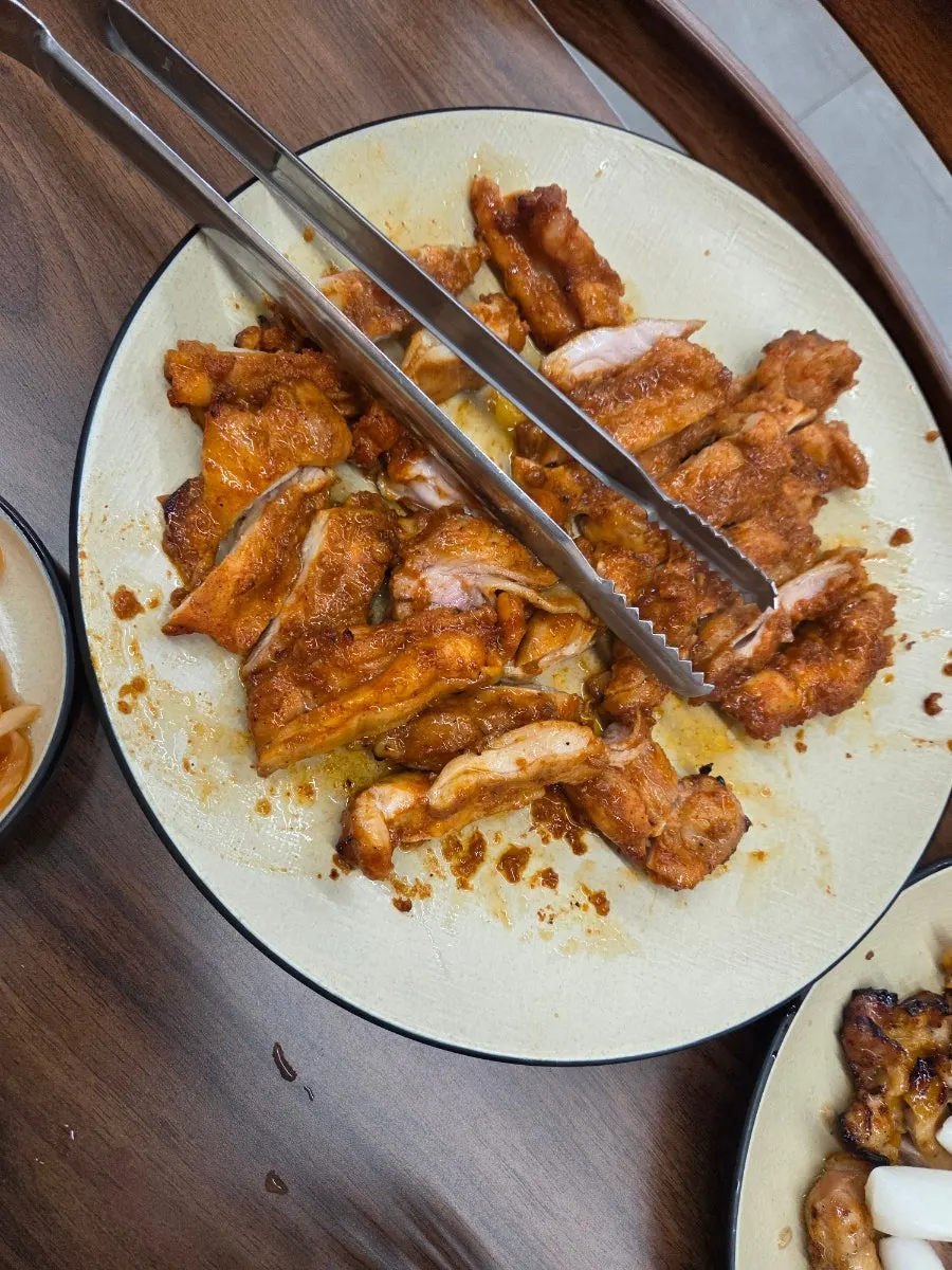 Table set with both soy-marinade and soy-sauce dakgalbi