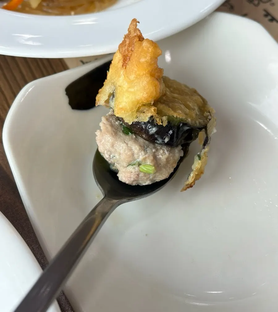 Mung bean jelly topped with seaweed flakes and vegetables