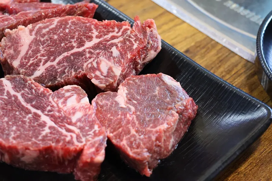 Cross-section of the thick hanwoo tenderloin showing bright red color and marbling
