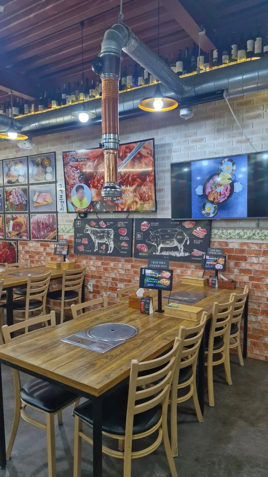 Exterior of a meat restaurant with a large parking lot