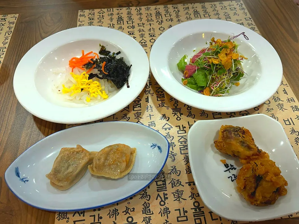 Appetizer of salad, mandu, cheongpomuk, and fried eggplant