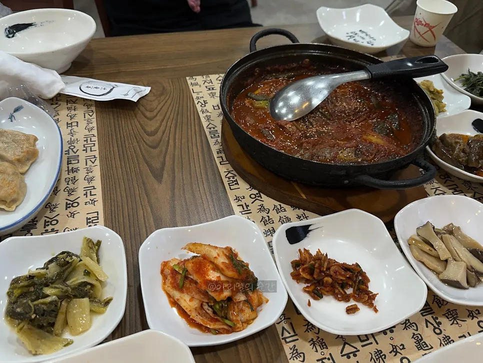 Full table spread served with the braised cutlassfish