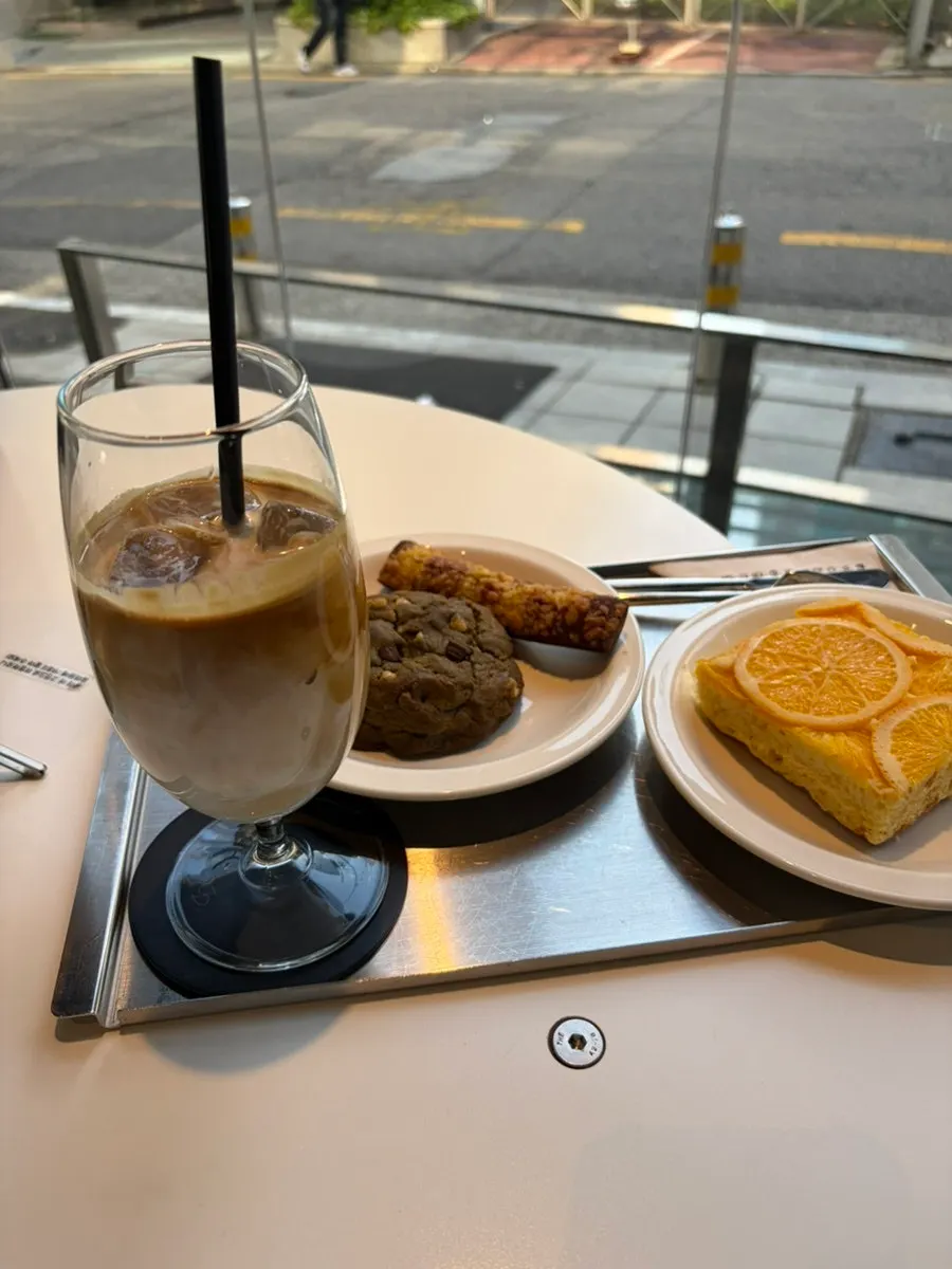 Table setting with Helsinki latte and three desserts