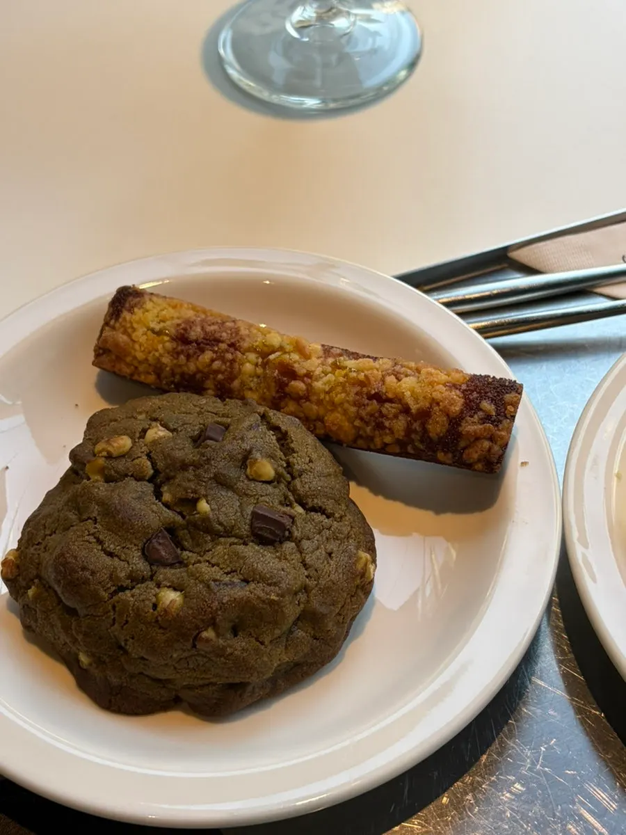 Dessert plate served alongside the latte