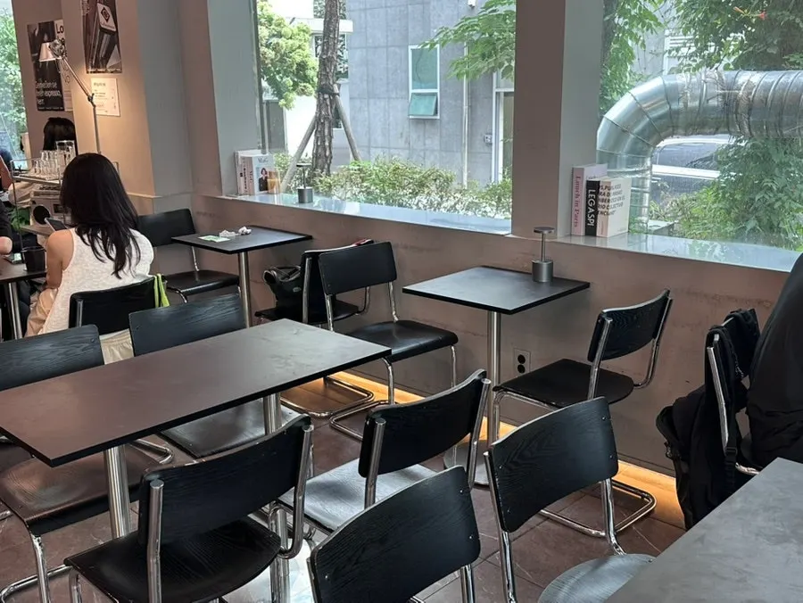 Outdoor tables at Mini Male Yeoksam on a rainy day