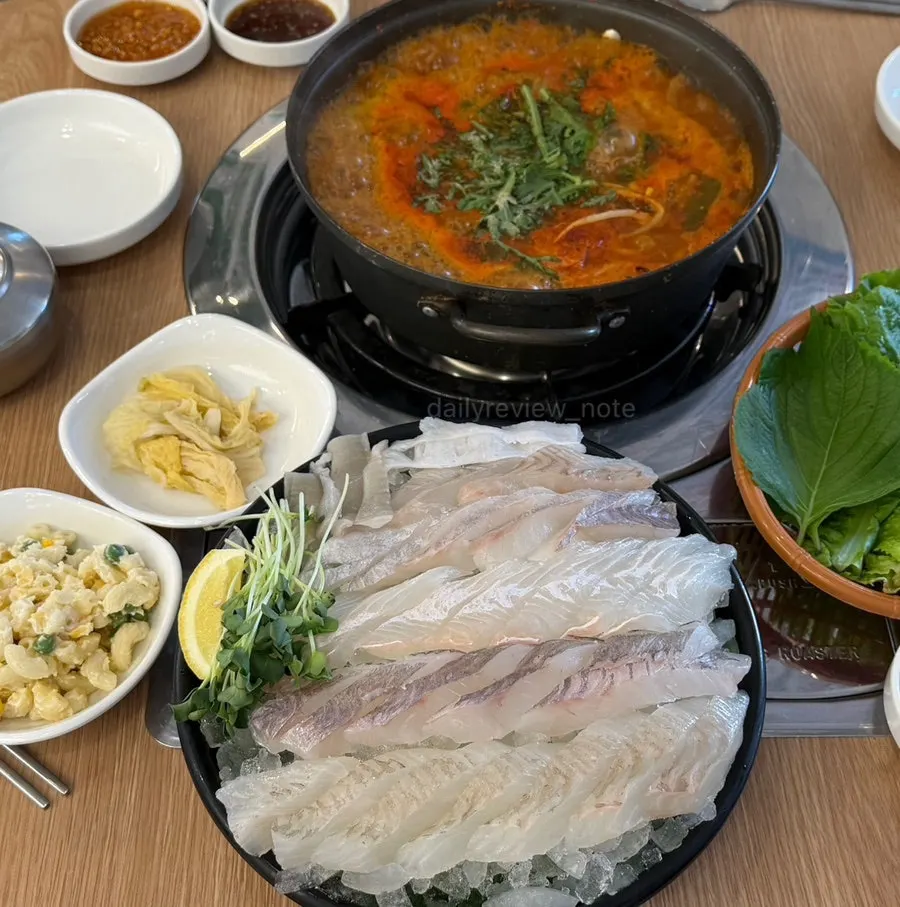 Halibut and rockfish sashimi on ice alongside seodeori spicy fish stew