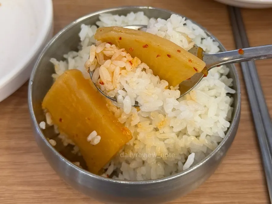 Ladle scooping up fish flesh and radish