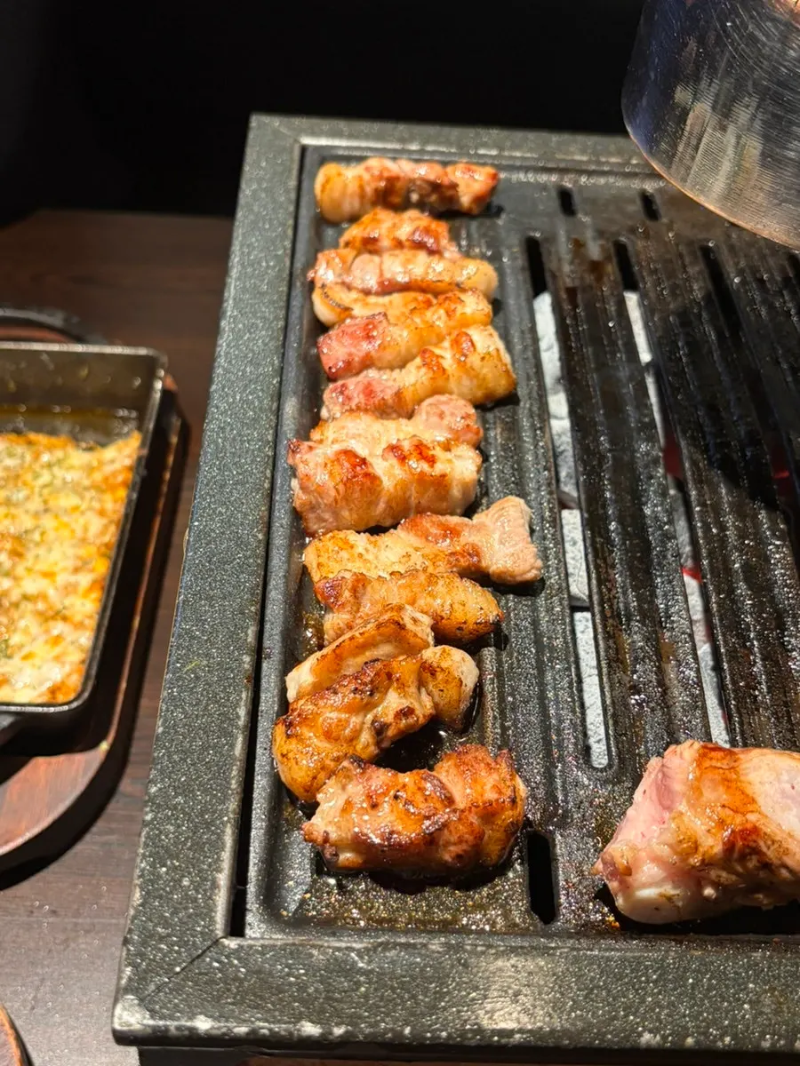 Grilled meat served with side dishes