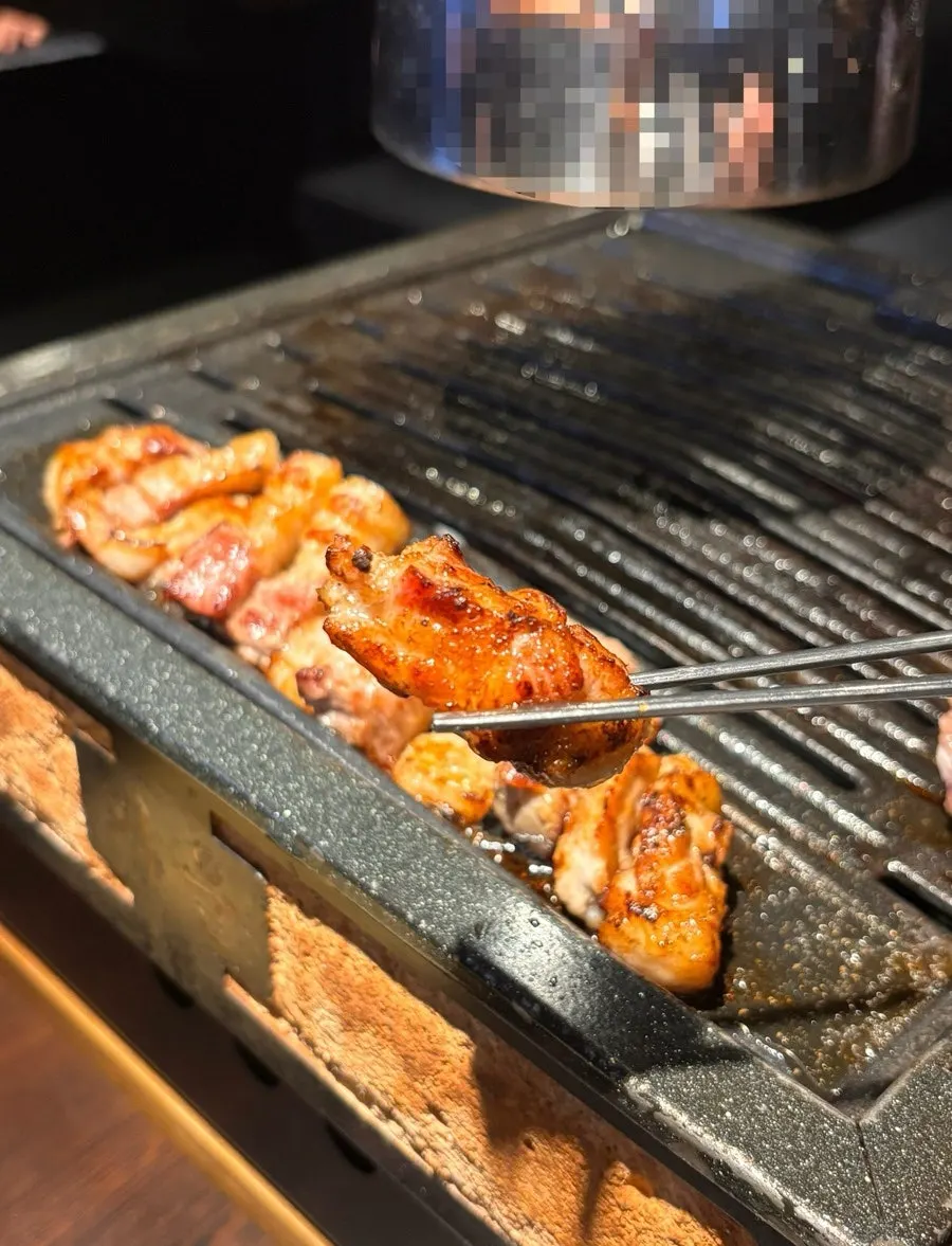 A single bite of galbi samgyeopsal