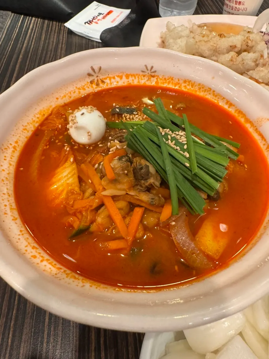 Jjamppong bowl generously filled with clams and seafood