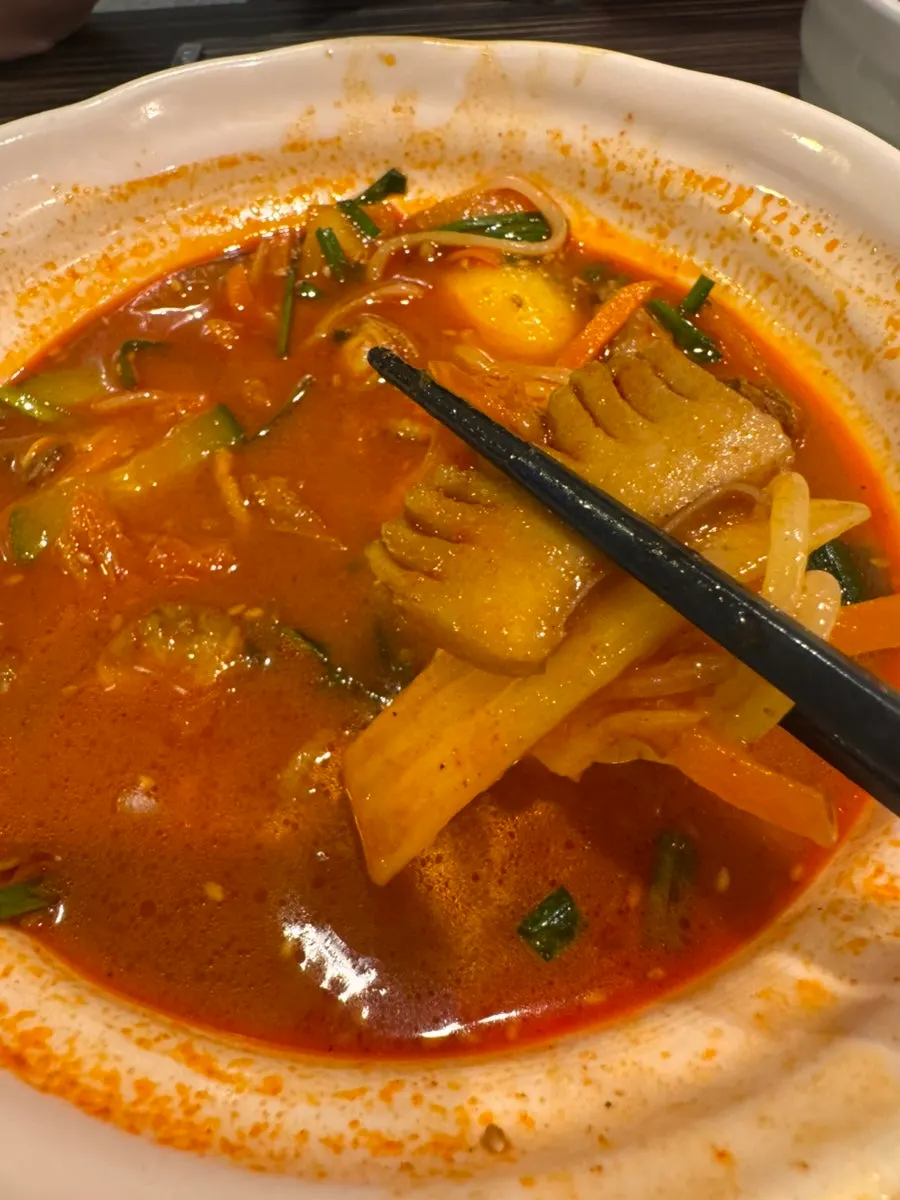 Jjamppong noodles lifted out of the bowl
