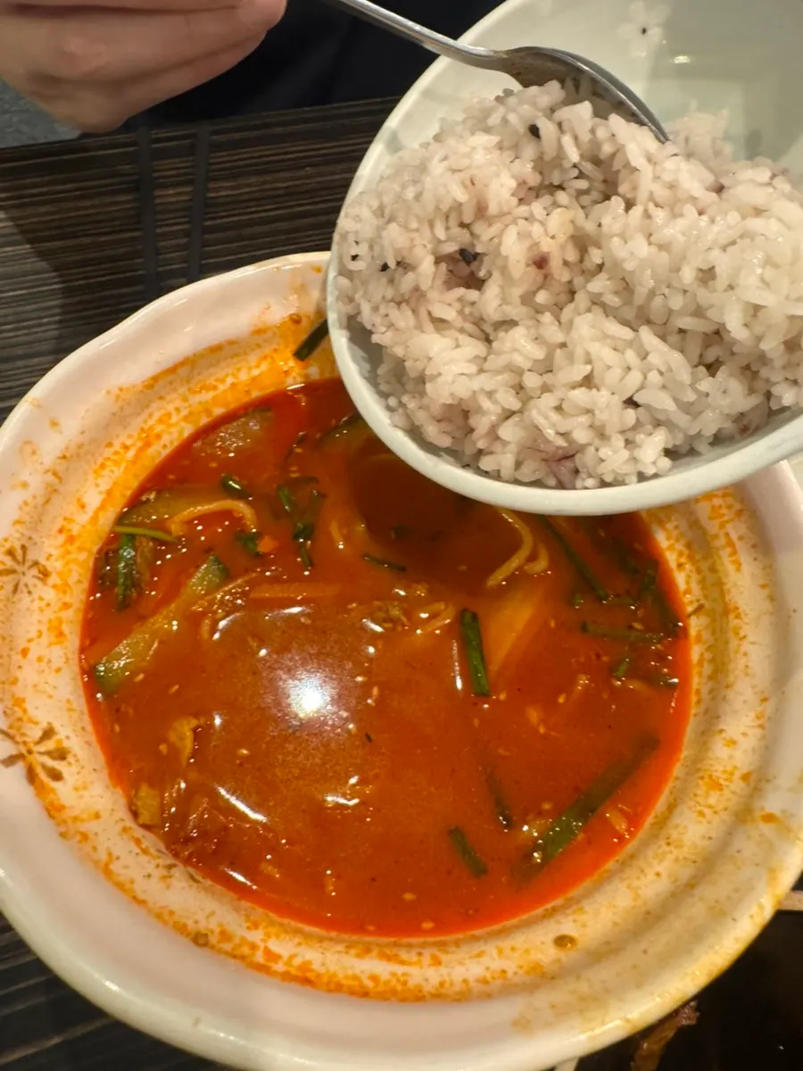 A bowl of jjamppong with a broth that keeps pulling you back