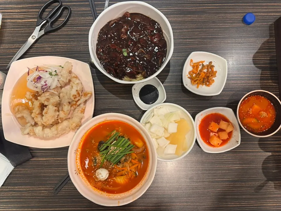 A plate of sweet and sour pork ordered alongside the noodles
