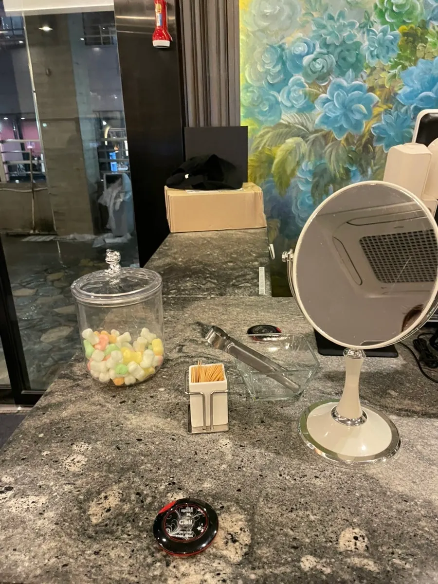 In-store restroom with mirror and toothpicks