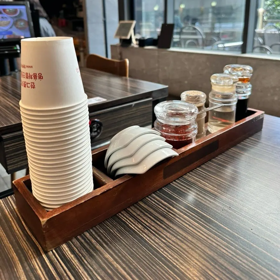 Table setting with paper cups and sauces