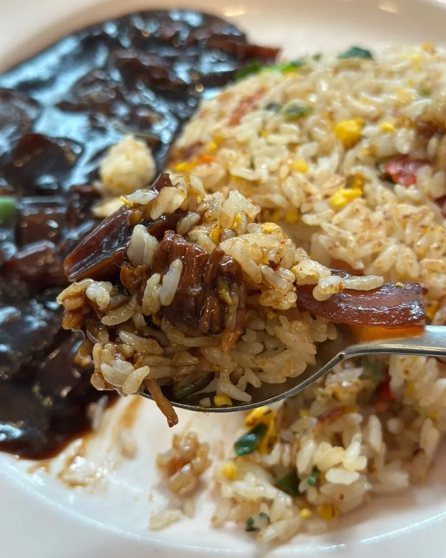 Close-up of crab fried rice mixed with jjajang sauce