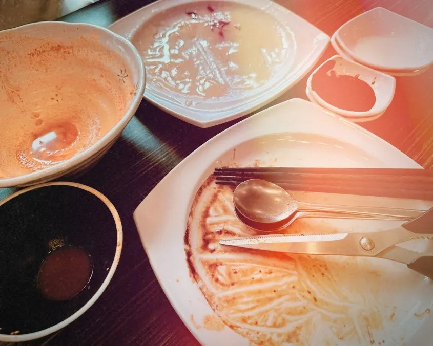 A full table with jjamppong, fried rice, and glutinous rice sweet and sour pork