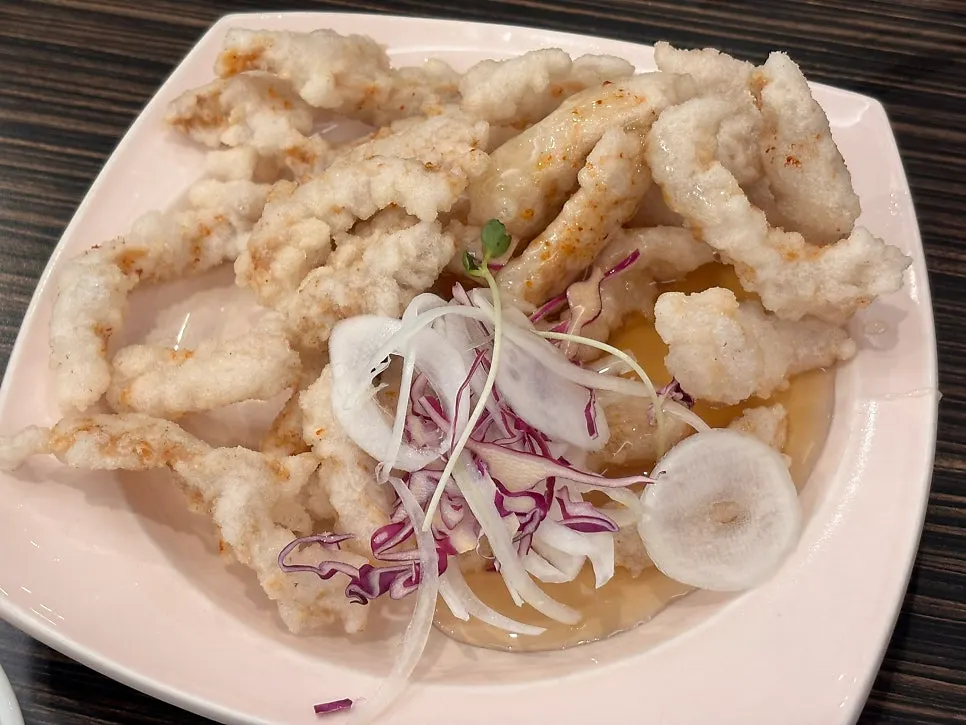 A plate of small crispy sweet and sour pork