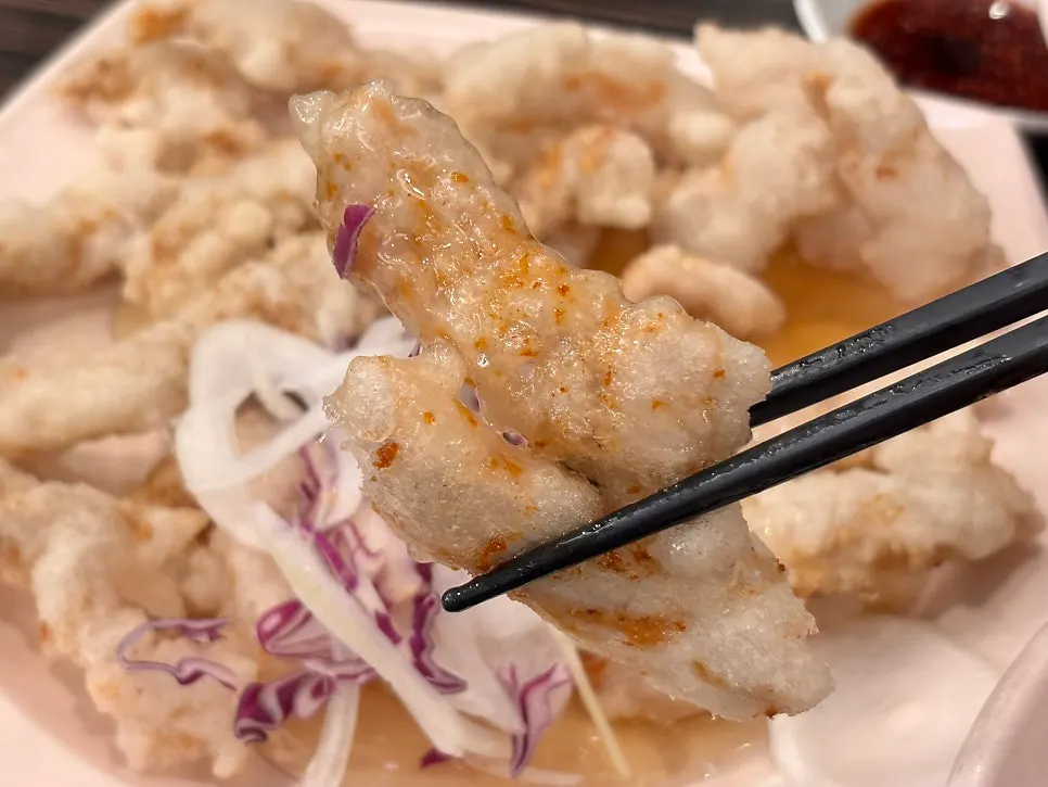 Cross-section of the crispy sweet and sour pork batter and meat