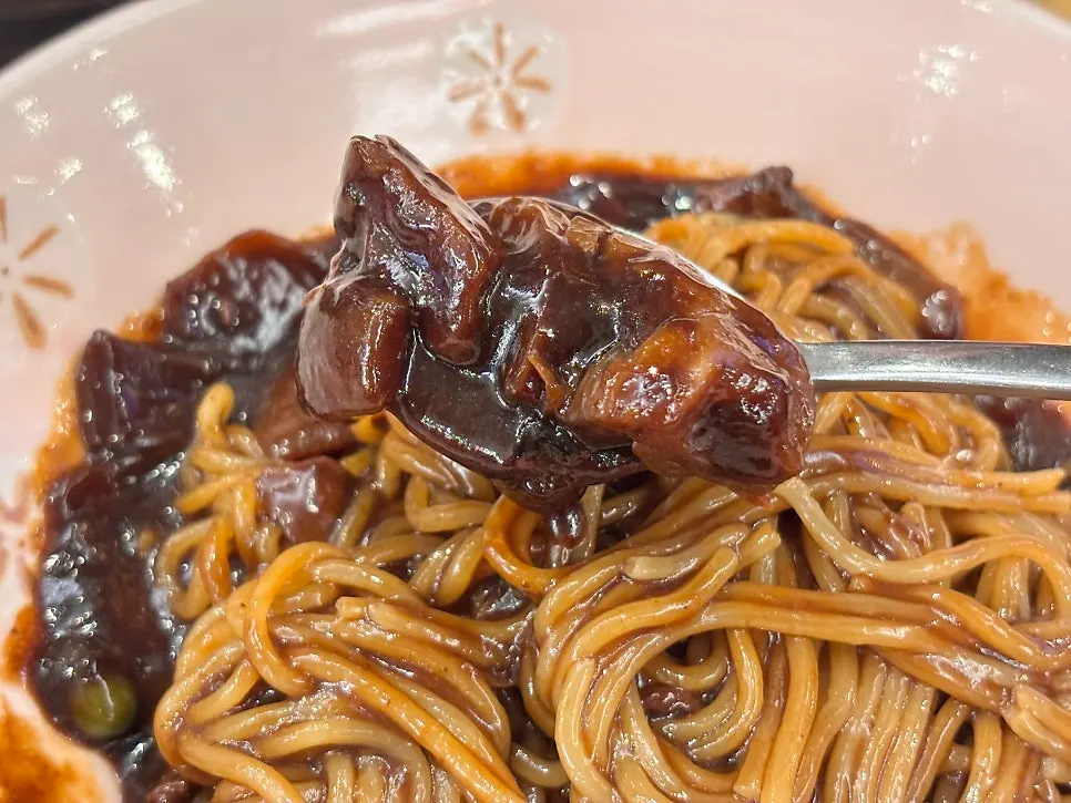 Big chunks of potato and meat in the jjajang sauce