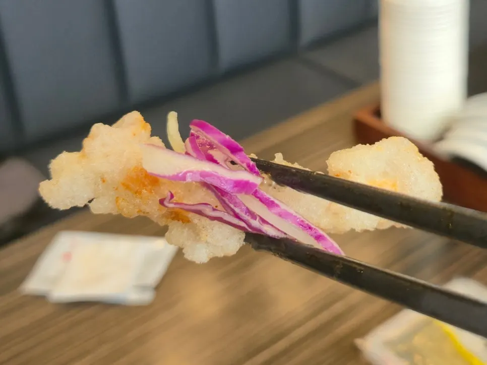 Tangsuyuk served with onion and shredded cabbage
