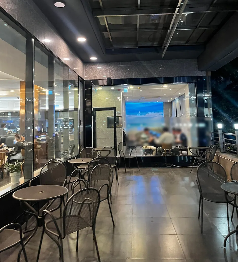 Stairs on the right leading up to the 2nd-floor restaurant