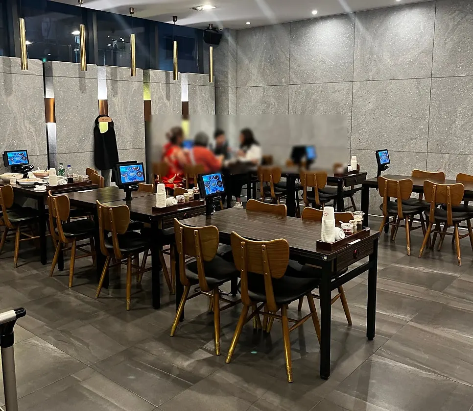 Spacious dining hall with 2-person and 4-person tables