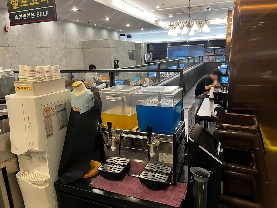 Self-serve bar with small plates, scissors, tongs, and aprons