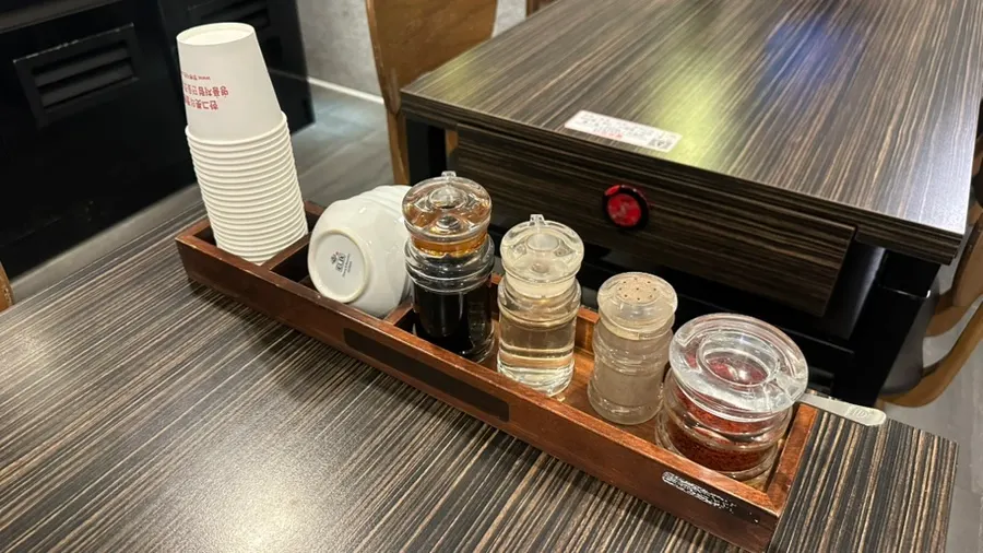 Chili flakes and vinegar set on the table