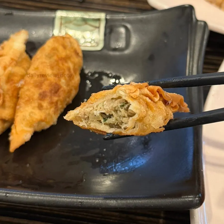 Inside of a dumpling packed with meat and vegetables