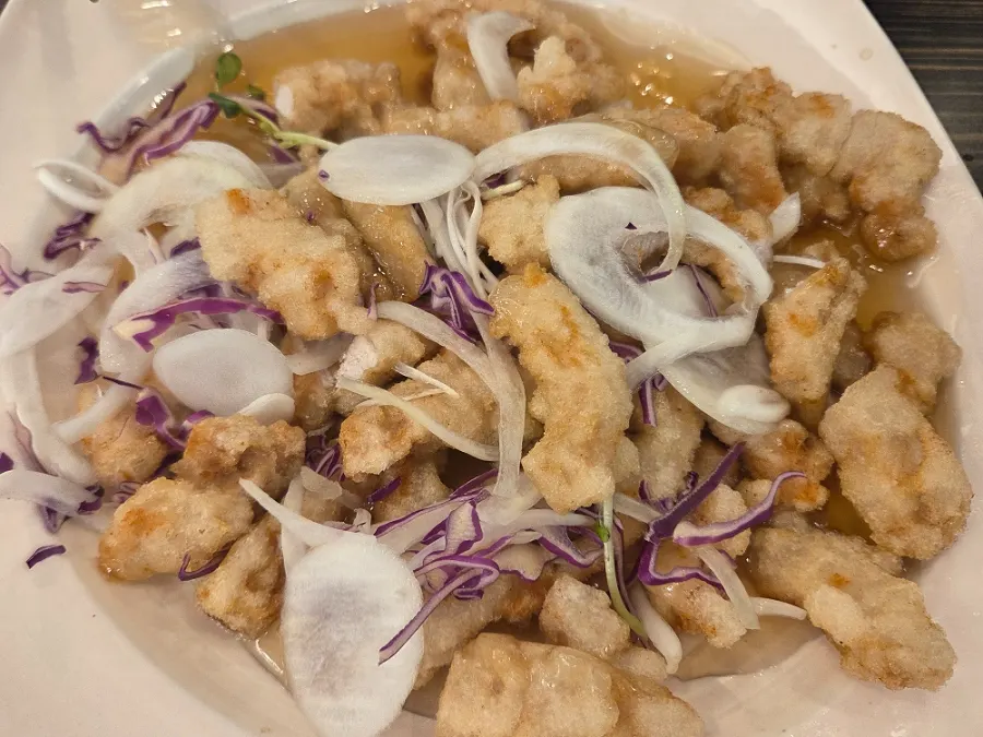 Close-up cross-section of sauce-coated sweet-and-sour pork
