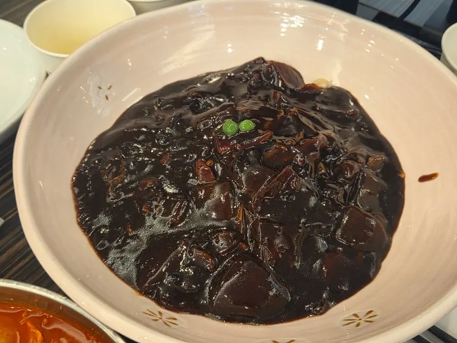 Close-up of a single piece of sweet-and-sour pork
