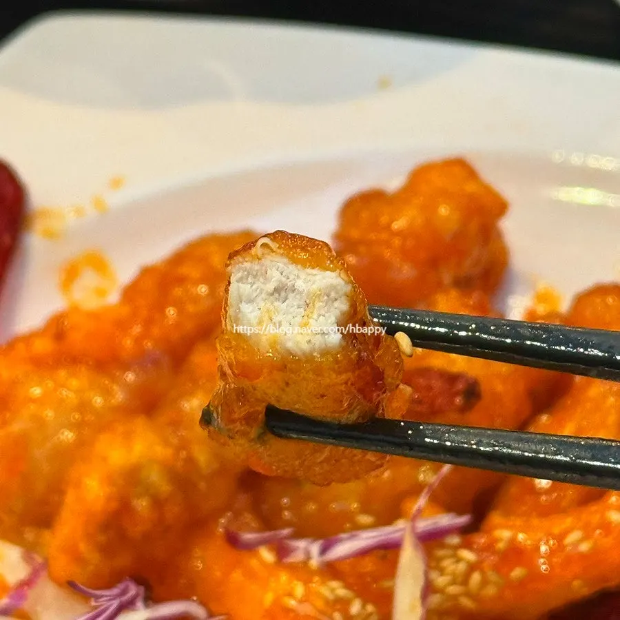Cross-section of sweet and sour pork showing generous meat filling