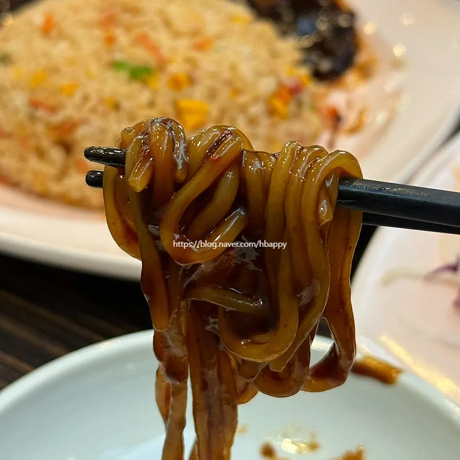 Chewy noodles coated in black bean sauce