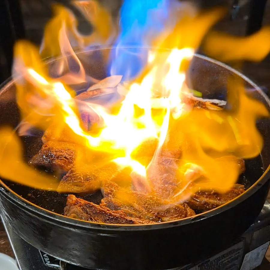 Ravi marinated ribs being grilled