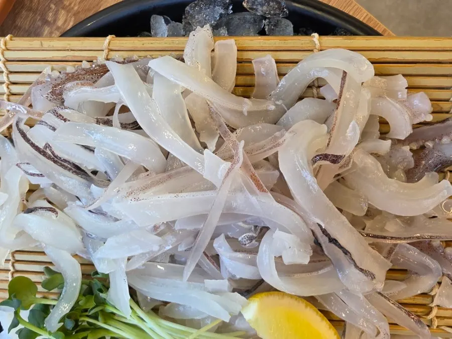 Plate of fresh live squid sashimi