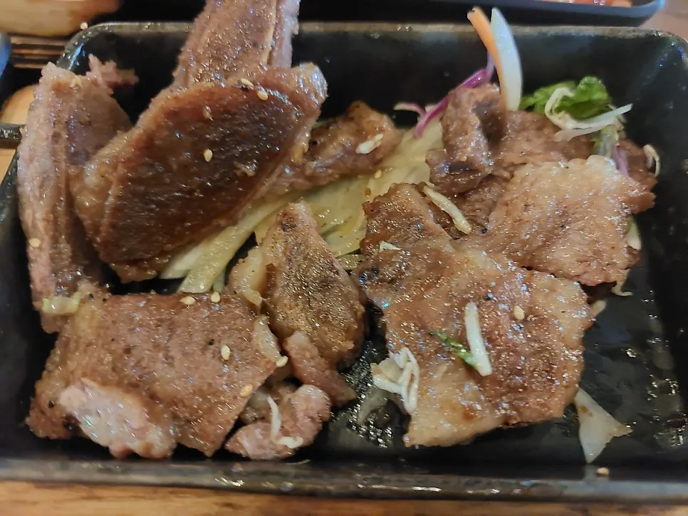 Close-up of marinade-soaked charcoal LA galbi