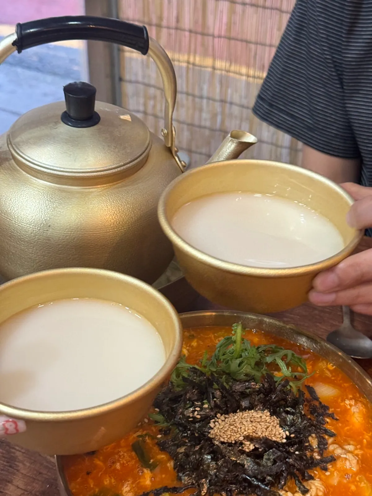 Cold iced makgeolli poured into a glass