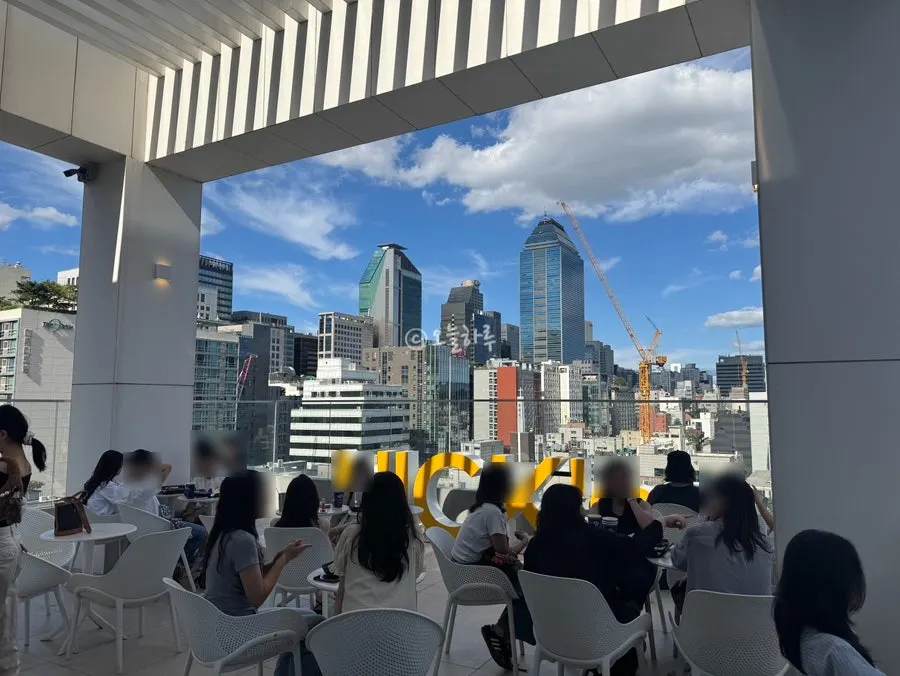 Rooftop seating overlooking downtown Gangnam
