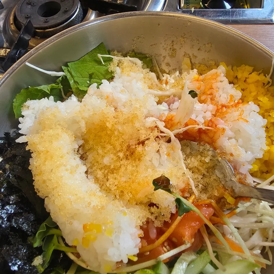 Raw fish rice bowl mixed with sauce and rice