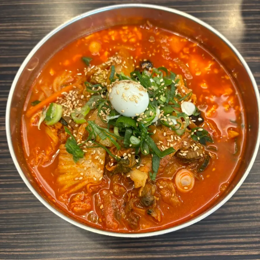 A bowl of soft tofu noodle soup ordered at regular spice level