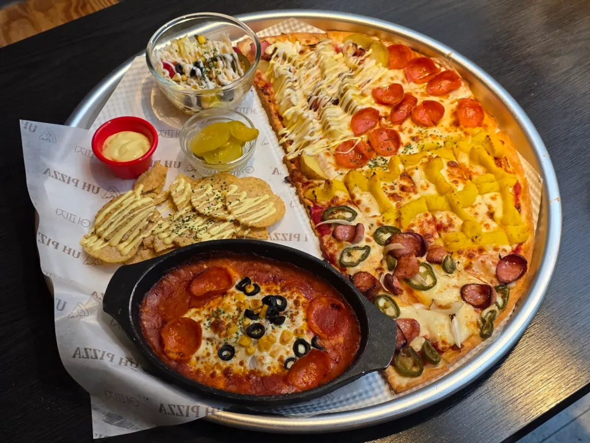 Potato pizza next to a glass of Hoegaarden draft
