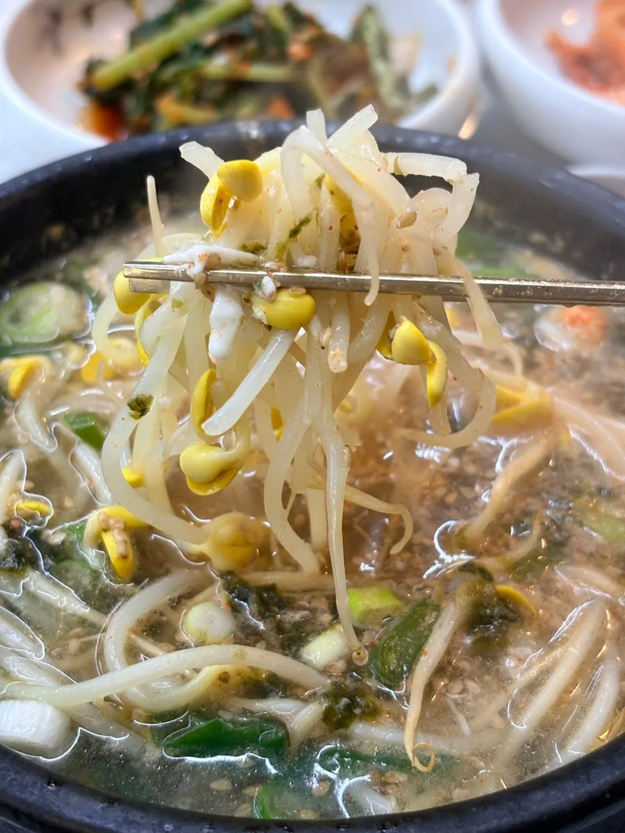Bean sprout hangover soup served with a bowl of rice