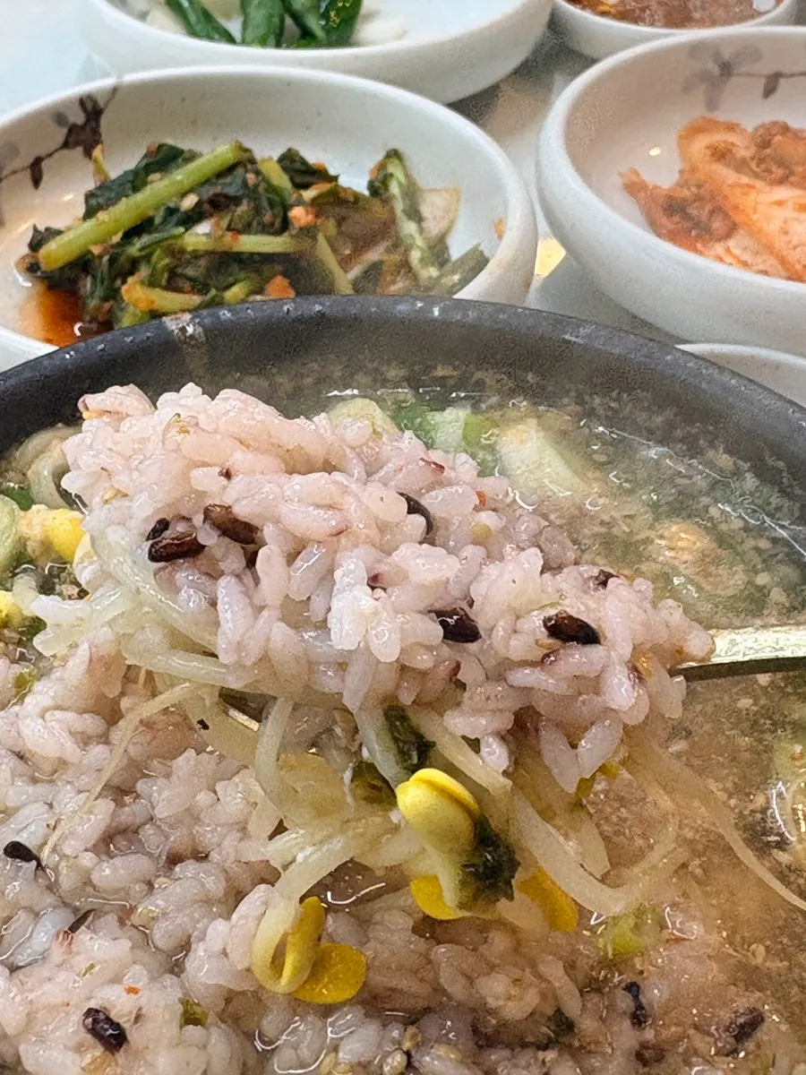 A spoonful of bean sprout hangover soup broth