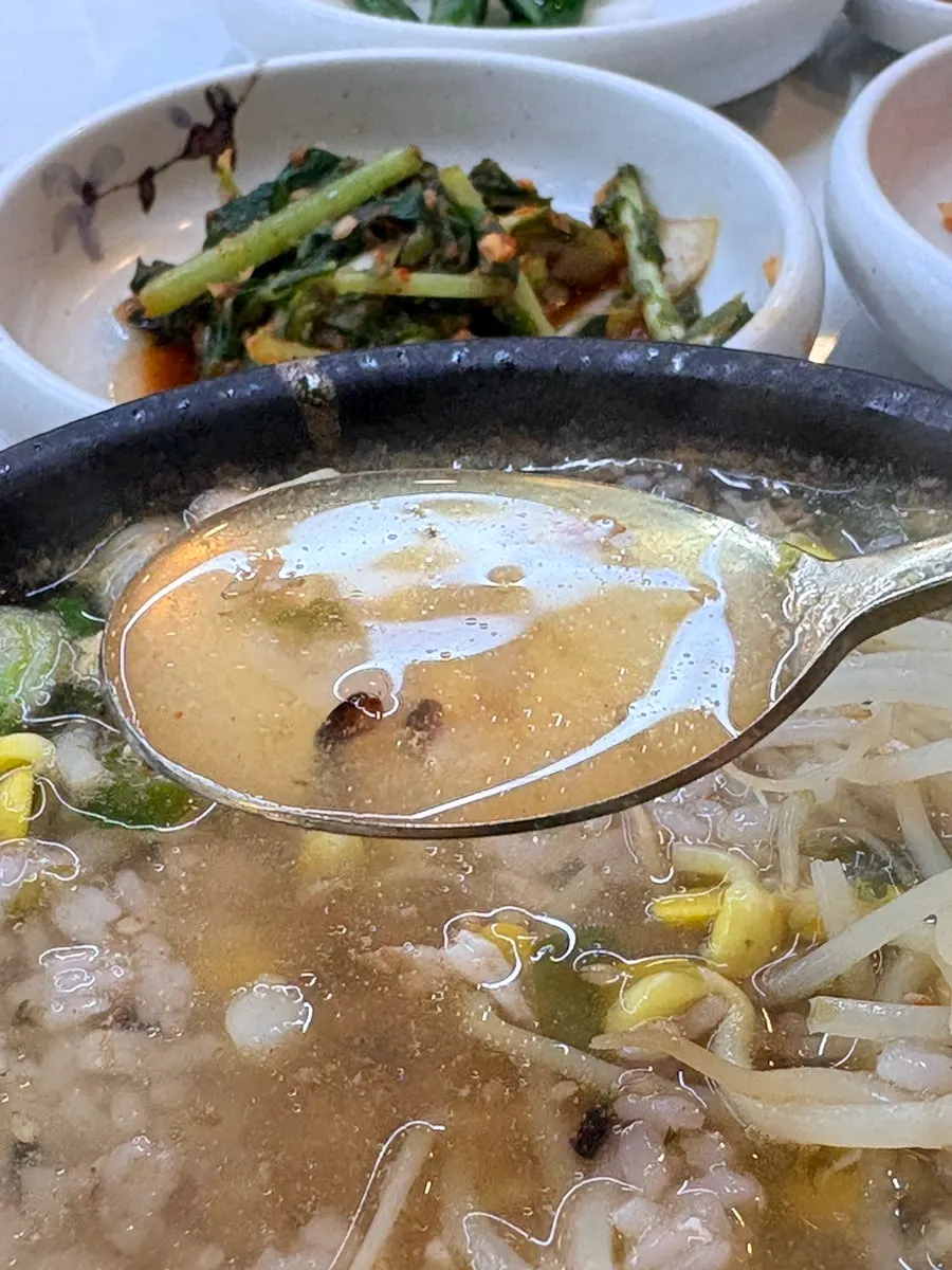 Rice mixed into bean sprout hangover soup