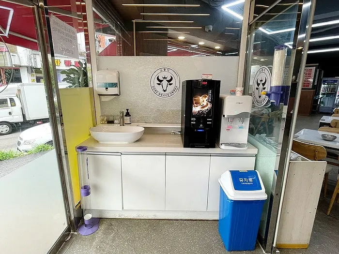 Hand-washing spot set up on the left of the restaurant entrance