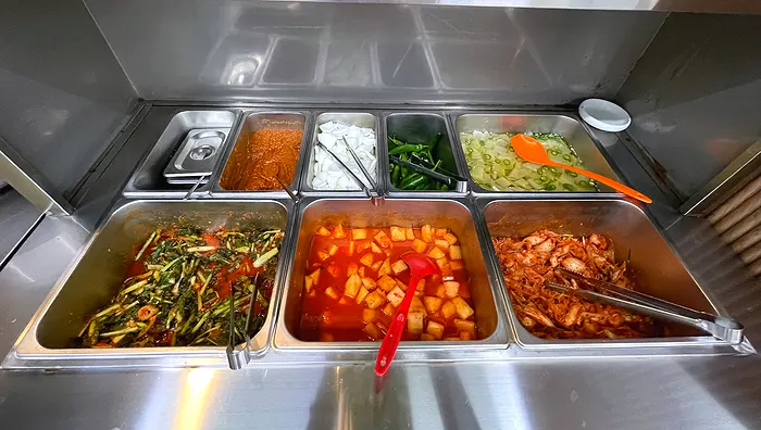 Self-serve corner with ssamjang, onion, chili, and pickled radish