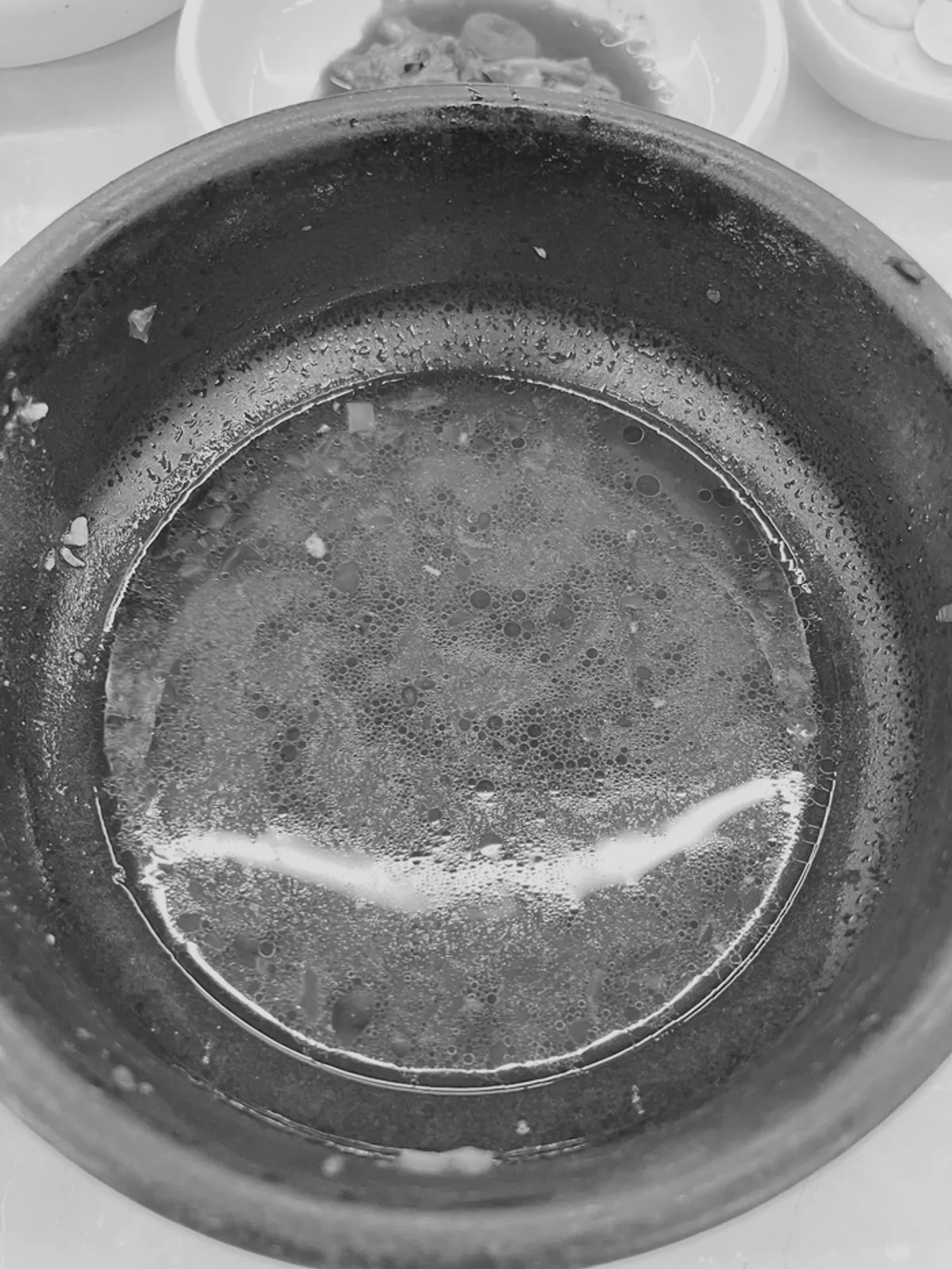 A bowl of haenaetang with chili paste and chili oil added